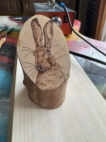 Hare log slice pyrography